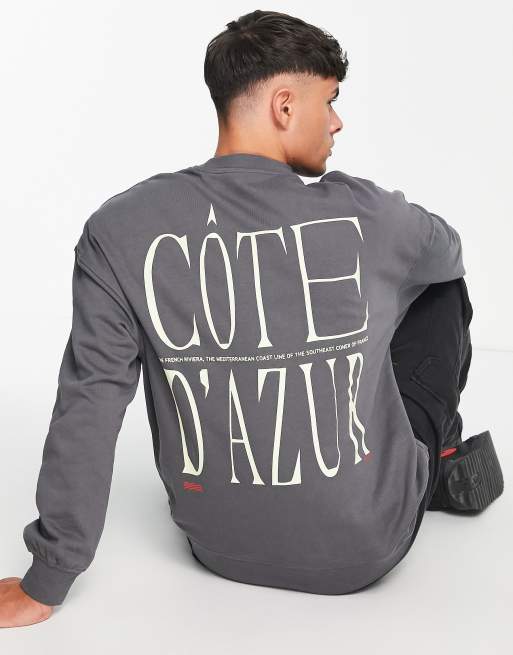 Sudadera gris extragrande con cuello redondo y estampado en la espalda 