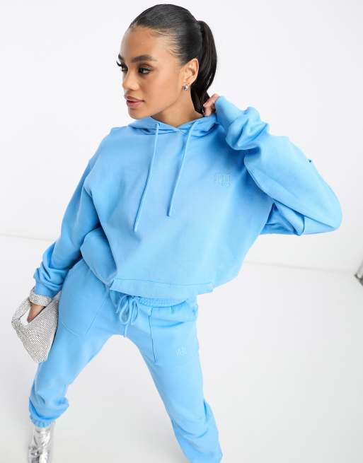 Sudadera larga azul con capucha y detalle de la marca de ASYOU (parte de un conjunto)