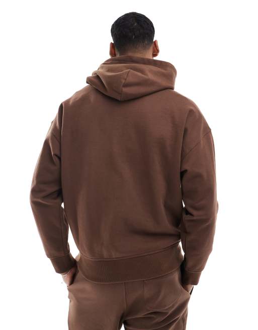 Sudadera marrón holgada extragrande con capucha y logo de texto y