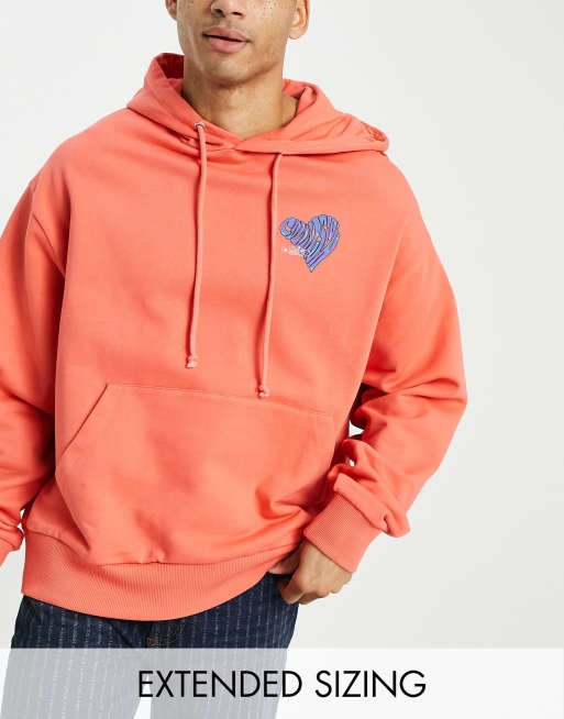 Sudadera naranja extragrande con lavado ácido, capucha y estampado de corazón con logo de COLLUSION