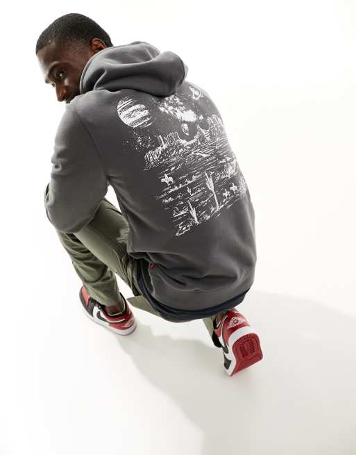 Sudadera negra con capucha y estampado espacial en la espalda de Levi's