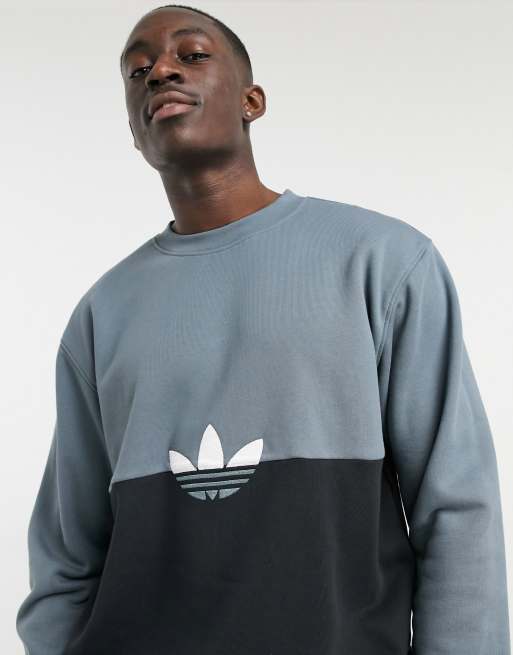 Sudadera negra con dise o color block y logo de tr bol de adidas