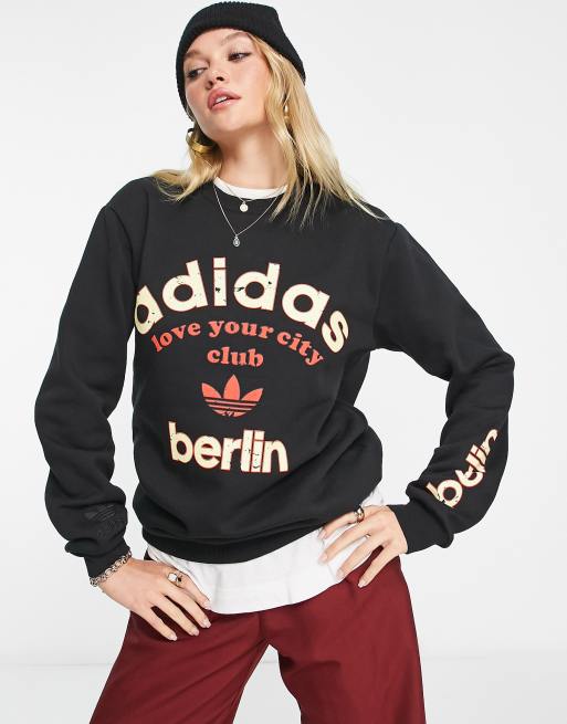 Sudadera negra logo Berlin de adidas | ASOS