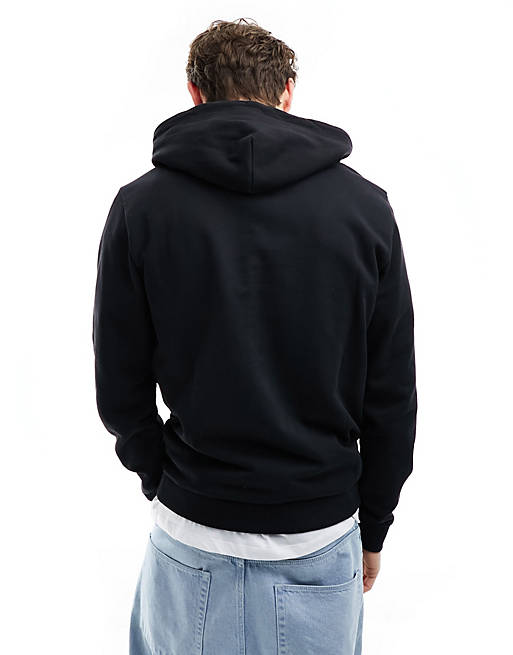 Sudadera negra de corte estándar con capucha y logo de estilo universitario  de camuflaje de Tommy Jeans