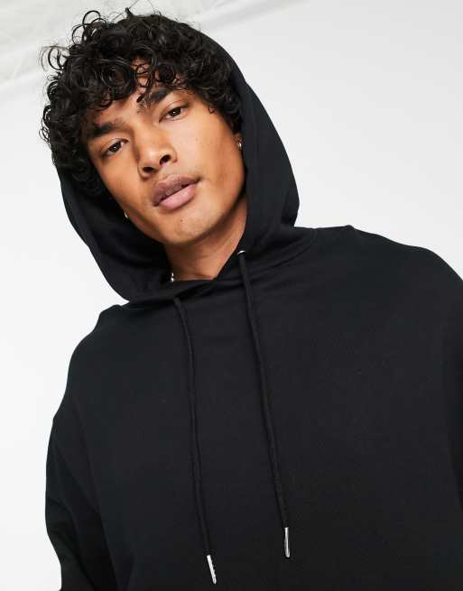 Sudadera negra extragrande con capucha y estampado efecto acuarela en el  pecho y la espalda de ASOS DESIGN