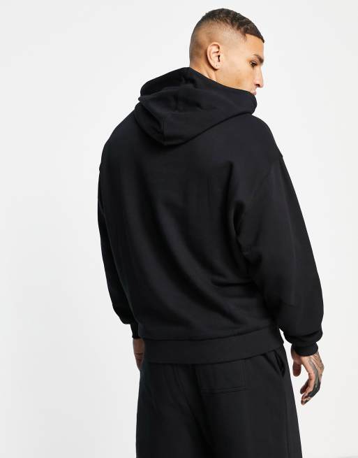 Sudadera negra extragrande con capucha y estampado de dibujo lineal en la  espalda de ASOS DESIGN