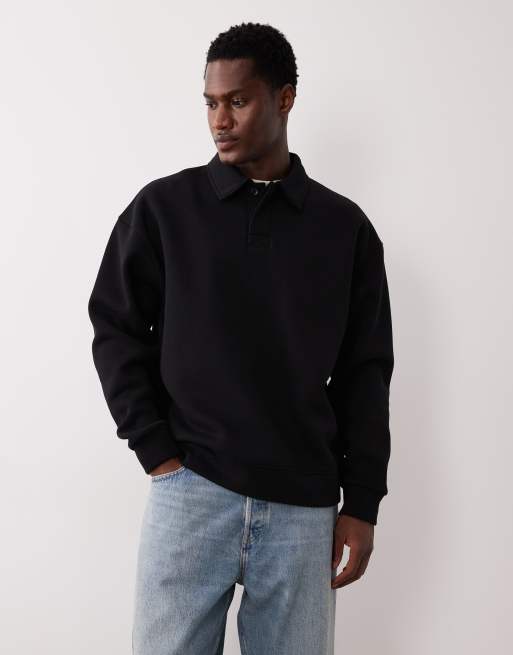 Sudadera negra extragrande tipo polo de ASOS DESIGN