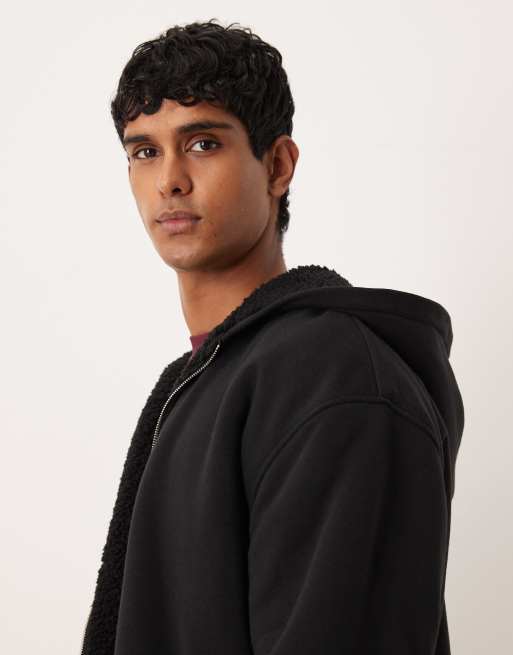 Sudadera negra holgada con capucha, cremallera y forro de borreguito de ASOS DESIGN, 4 de 5