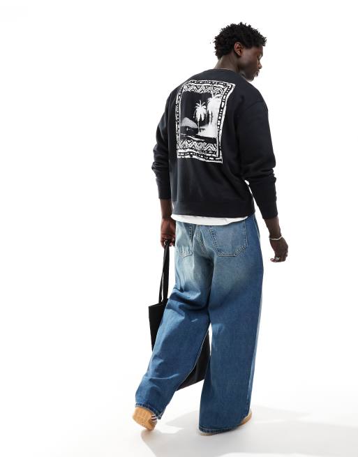 Sudadera negra holgada con logo y estampado de paisaje con palmera en la espalda de Levi's
