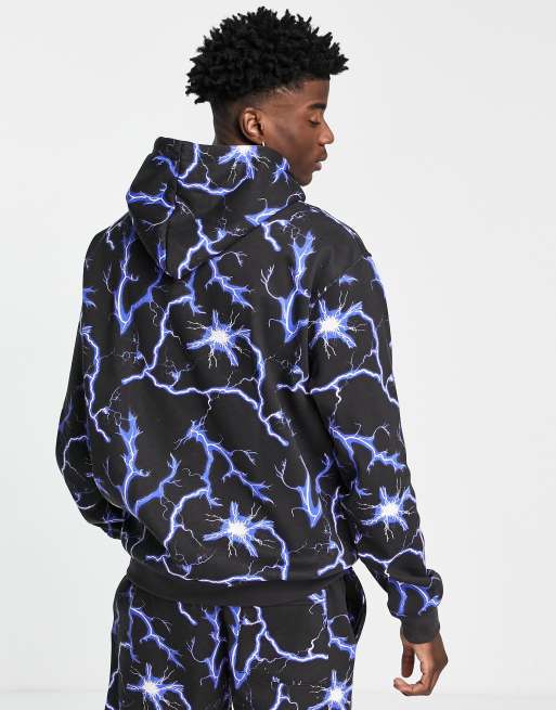 Sudadera negra sin cierres con capucha y estampado de rayos por