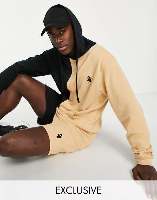 Sudadera negra y color camel con capucha y diseño dividido de South Beach 