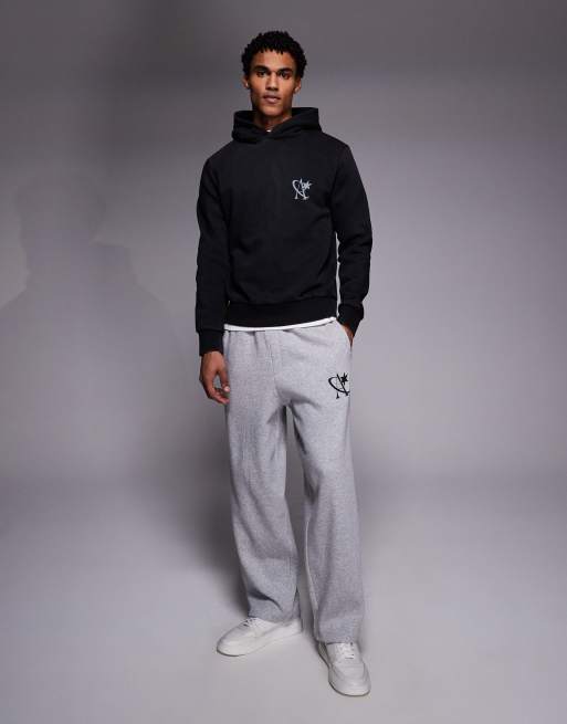 Sudadera negro lavado extragrande con capucha y logo de estrella de ADPT, 2 de 5