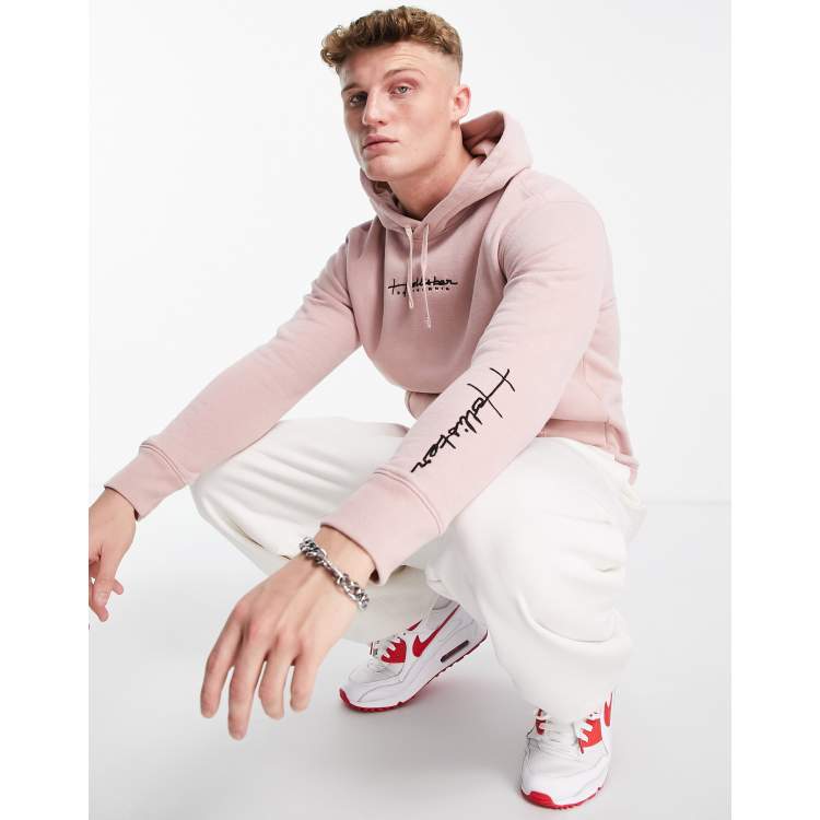 claro con capucha y logo de Hollister | ASOS