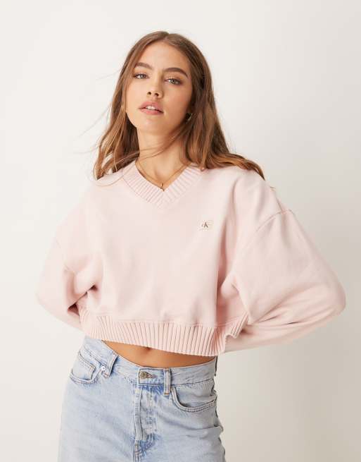 Sudadera rosa con cuello de pico y parche de tejido de Calvin Klein Jeans