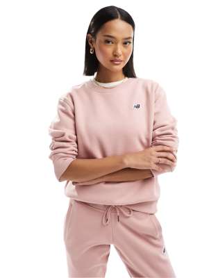 Sudadera rosa con cuello redondo y logo pequeño NB de New Balance