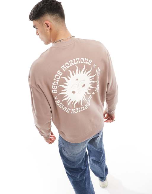 Sudadera rosa extragrande con estampado de sol en la espalda de ASOS DESIGN