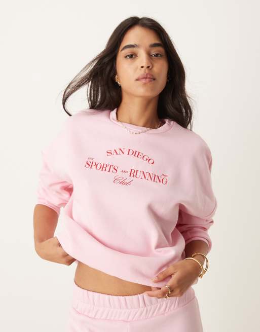 Sudadera rosa pastel con texto 