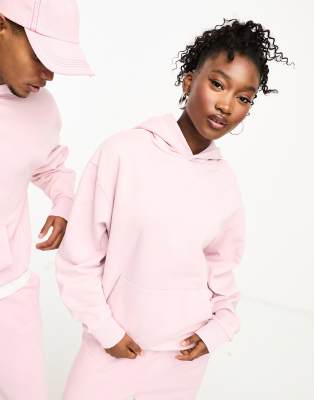 Sudadera rosa unisex con capucha Studios de COLLUSION