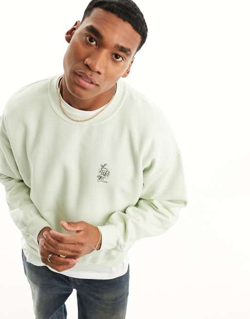 Sudadera verde claro con rosa y texto de New Look