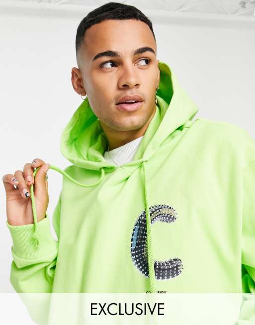 Sudadera verde con capucha y logo de pinchos estampado de COLLUSION
