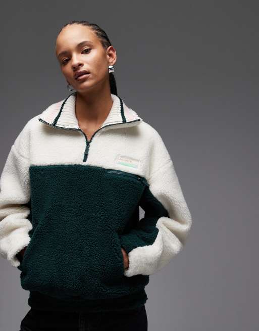 Sudadera verde con cuello tipo polo de Lacoste
