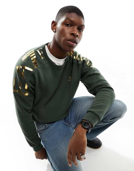 Sudadera verde con logo en los hombros de EA7