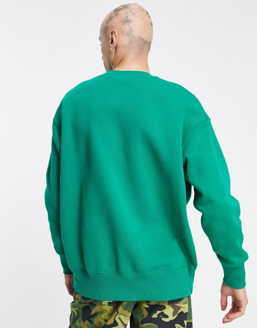 Sudadera verde malaquita unisex extragrande con cuello redondo y logo pequeño de Nike, 3 de 4
