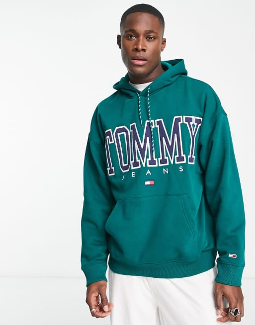 Sudadera verde medio de corte skater con capucha y logo en el pecho de la colección cápsula Heritage exclusiva en ASOS de Tommy Jeans
