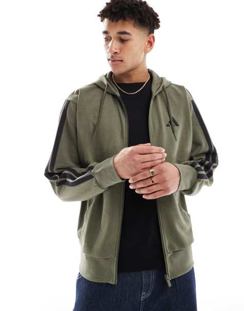 Sudadera verde oliva con capucha, detalle de 3 rayas negras y cremallera de felpa de rizo de adidas Essentials - view 1