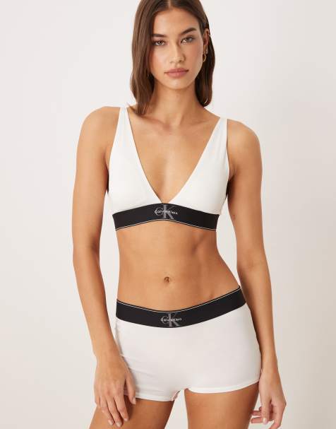 Sujetador blanco triangular con relleno ligero y logo gráfico de Calvin Klein - view 1