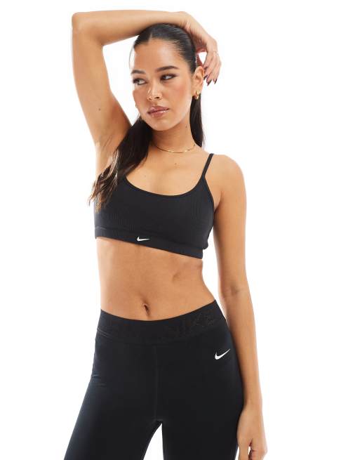 Sujetador deportivo negro de sujeción ligera de canalé de Nike Training