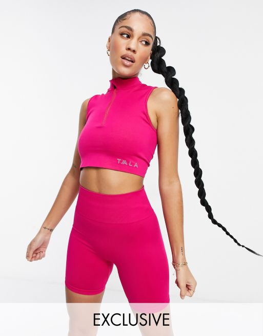 Sujetador deportivo rosa de sujeción media con media cremallera Zahara exclusivo en ASOS de Tala