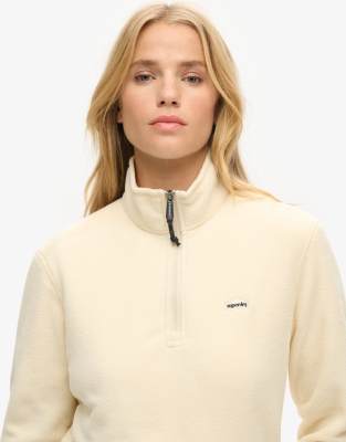 Superdry - Cropped Polarfleece-Pullover in Hellbeige mit kurzem Reißverschluss-Weiß