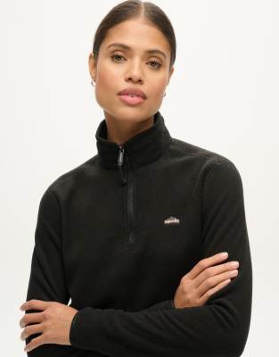 Superdry - Cropped Polarfleece-Pullover in Schwarz mit kurzem Reißverschluss