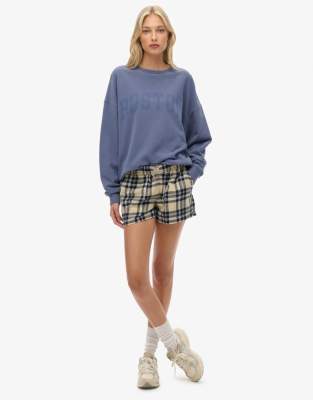 Superdry - Elastische Hose aus Baumwolle in Cremeweiß/Marineblau kariert