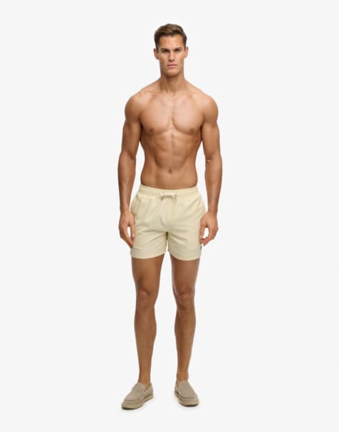 Superdry Embroidered logo 15- inch swim shorts in pastel yellow - view 1
