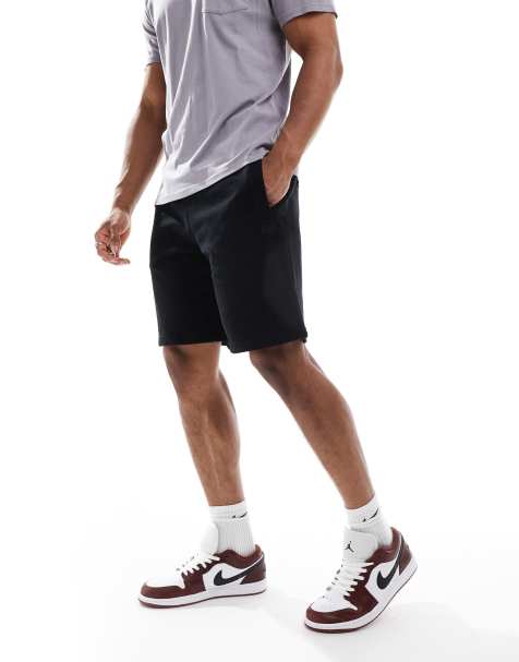 Superdry Essential logo jersey shorts in black - view 1