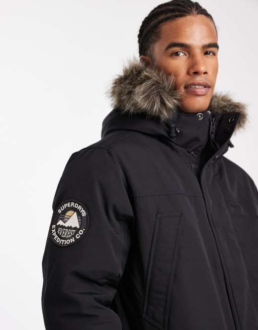Superdry – Everest – Parka-Jacke in Tiefschwarz mit Kunstpelz ASOS