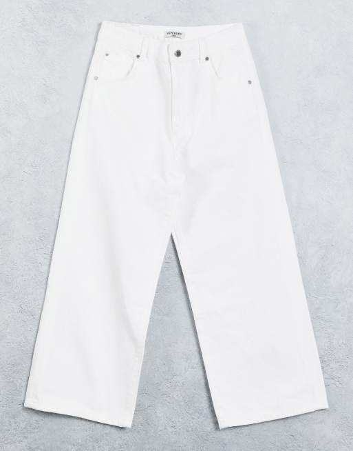 Superdry - Jeans corti con fondo ampio, colore bianco
