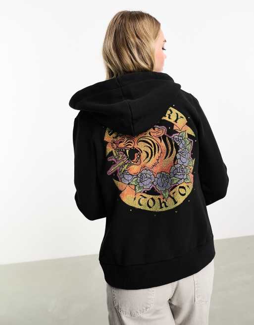 Superdry – Kapuzenpullover in Schwarz mit Strass-Tattoomotiv