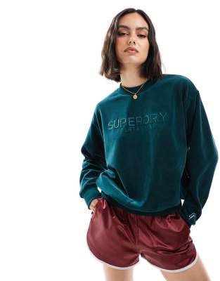 Superdry - Kastiges Sweatshirt aus Velours in Furnace-Grün mit Rundhalsausschnitt und Grafik