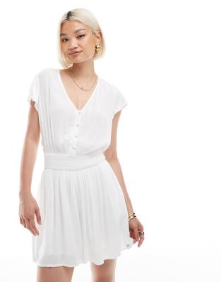 Superdry - Kurzärmliger Playsuit in Wollweiß mit Print