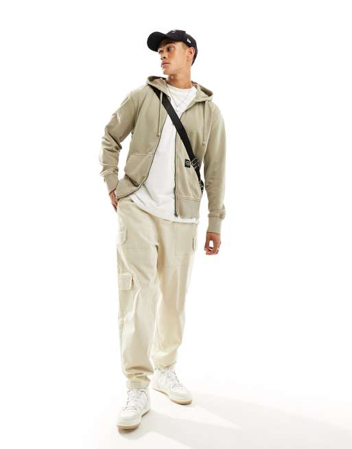 Superdry – Lässiger Kapuzenpullover in Vintage-Khaki mit kontrastierenden Ziernähten und Reißverschluss