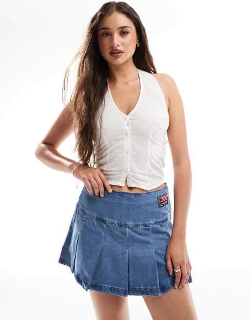 Superdry – Mini-Faltenrock in Vintage-Waschung mit Aufnäher