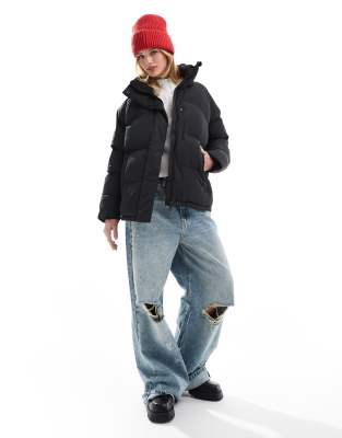 Superdry - Mittellange Pufferjacke in Schwarz