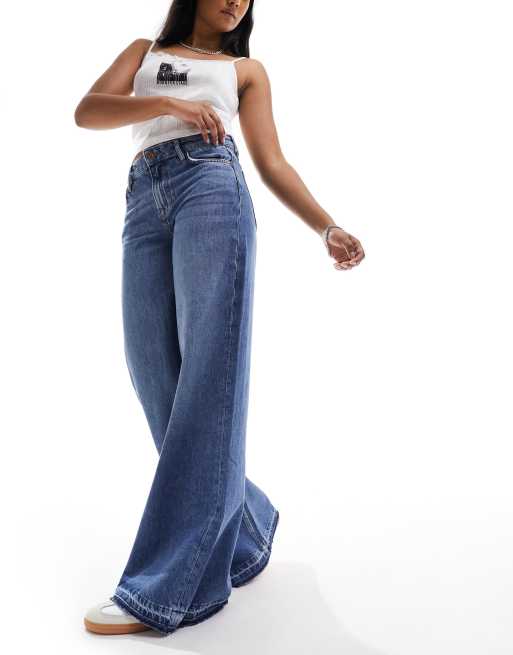 Superdry Raw hem wide leg flare jeans in wheeler vintage blue