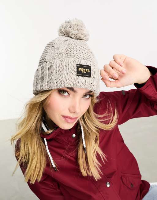 Superdry – Strickmütze in meliertem Hellbeige mit Zopfmuster
