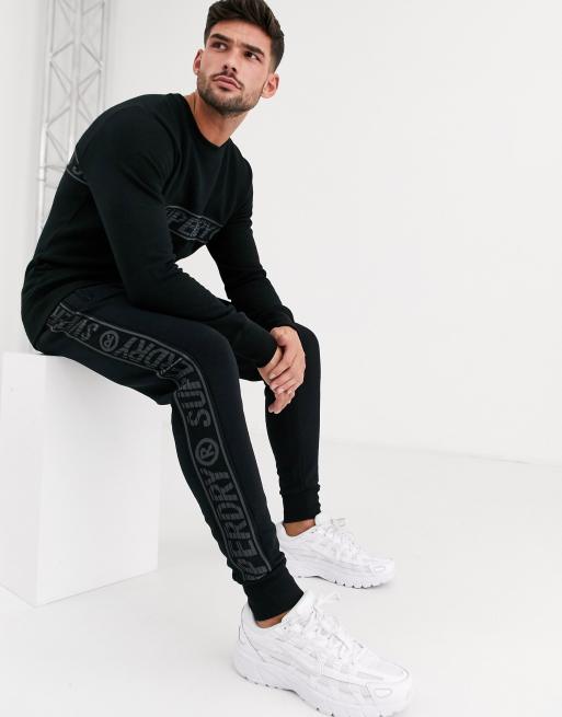 Superdry Universal taped tracksuit set in black ASOS