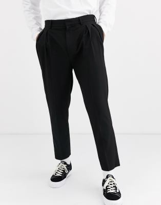 фото Суженные книзу укороченные брюки черного цвета с защипами asos design-черный