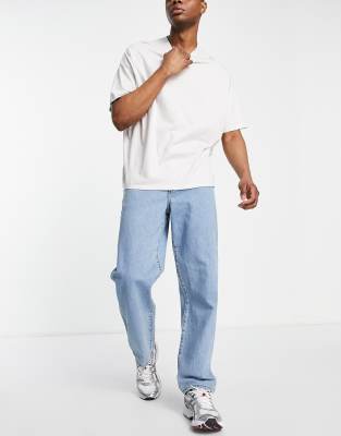 Светлые выбеленные джинсы свободного кроя ASOS DESIGN-Голубой